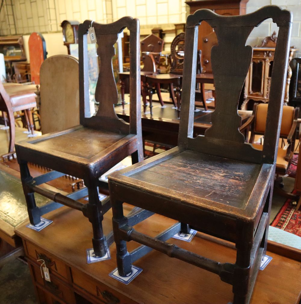 A pair of 18th century oak dining chairs